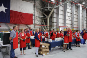 Roll Call Volunteers prepare to serve lunch at monthly luncheon in Fort Worth Texas April 2022