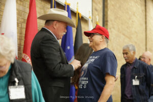 Tarrant County Sheriff Bill Waybourn pins a Vietnam Veteran at Fort Worth Roll Call Luncheon, January 2022