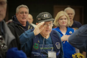 USAF Korea and Vietnam Veteran Curtis McKee salutes during Fort Worth Roll Call lunch February 2022