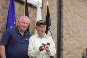 WWII Veteran Harmon Moody with piece of USS Arizona Fort Worth Roll Call May 2022