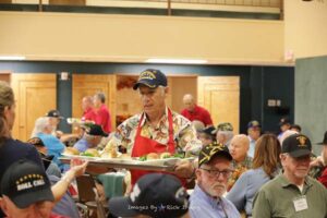 Roll Call Fort Worth volunteers serve veterans meals at luncheon September 2022