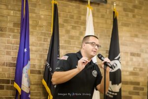 Veteran and comedian Chris Crawford entertains veterans at Roll Call Luncheon December 2022