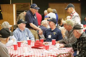 Veterans greet each other at Roll Call Luncheon Fort Worth Texas January 2023